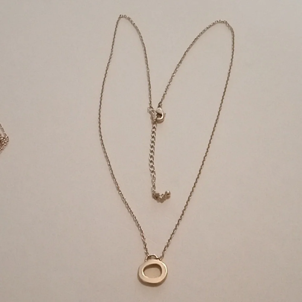 #1056.  5 Piece Assorted Gold Toned Pendant Necklace Bundle - Picture 11 of 11